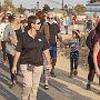 Amy joined with the people walking westward.