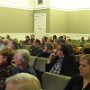 City Hall Chamber full of participants
