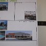 Esel boards display the many different features available to vote on for inclusion in the park.  Beside eace board is a picture of the votes cast in the first community meeting.