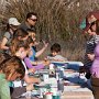 Having fun painting tiles for future use in the park.