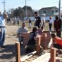 Building one of the raised beds for planting crops in the future community garden.  Jim Sweeney, Jean Sweeney Open Space Park Fund, Co-Chariman, standing on the left looks on as the box is assembled.