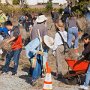 Volunteers of all ages are busy cleaning up the West end of the park.