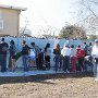 Designing the mural on the painted fence.