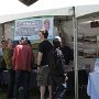 Jim Sweeney, , Jean Sweeney Open Space Park Fund Committee member, talks to a visitor at the booth.